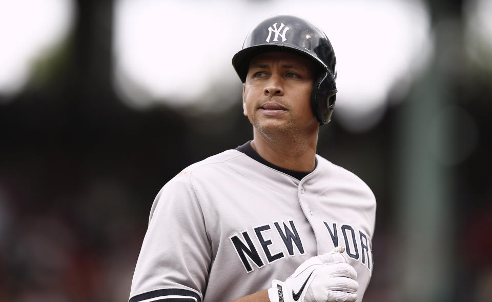 FILE - In this Sept. 14, 2013, file photo, New York Yankees' Alex Rodriguez heads to the dugout during the Yankees' 5-1 loss to the Boston Red Sox in a baseball game at Fenway Park in Boston. Rodriguez has accepted his season-long suspension from Major League Baseball, the longest penalty in the sport's history related to performance-enhancing drugs. Rodriguez withdrew his lawsuits against MLB, Commissioner Bud Selig and the players' association to overturn his season-long suspension on Friday, Feb. 7, 2014. (AP Photo/Winslow Townson, File)