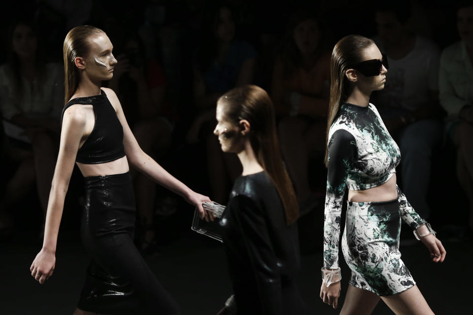 Models wear creations from the Auslander winter collection during Fashion Rio in Rio de Janeiro, Brazil, Saturday, Nov. 9, 2013. (AP Photo/Felipe Dana)