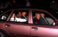 <p>O.J. Simpson, center of rear seat, is driven into the Los Angeles Police Department headquarters on Friday, June 17, 1994, after his arrest following a low-speed freeway chase which ended in the drive of his home in West Los Angeles. Simpson was charged with two counts of murder in connection with the slaying of his ex-wife Nicole, and Ron Goldman. (Photo: Bob Galbraith/AP) </p>