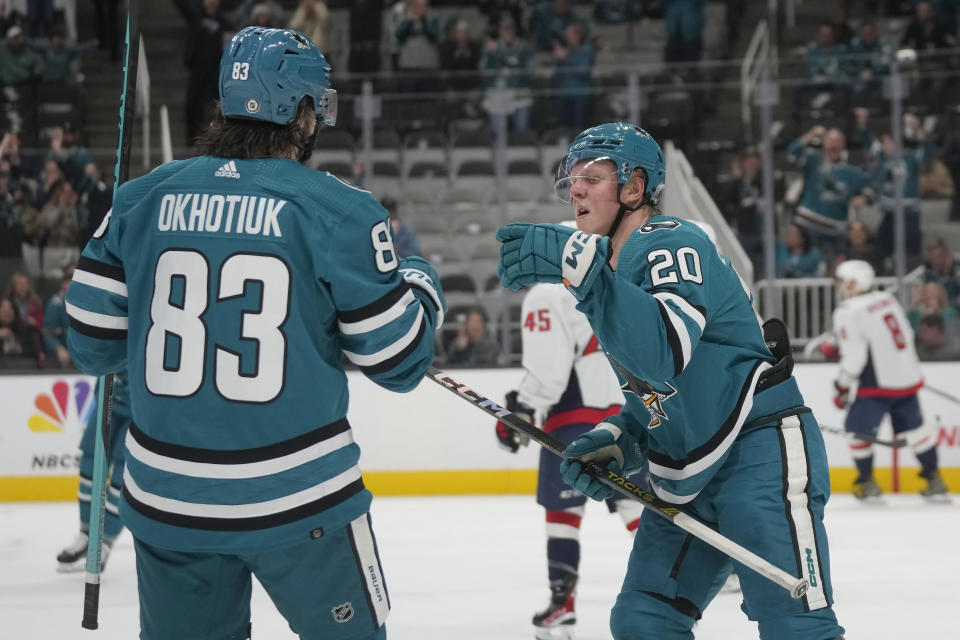 San Jose Sharks left wing Fabian Zetterlund (20) is congratulated by defenseman Nikita Okhotiuk (83) after scoring against the Washington Capitals during the first period of an NHL hockey game in San Jose, Calif., Monday, Nov. 27, 2023. (AP Photo/Jeff Chiu)