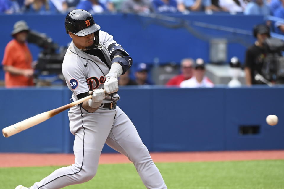 Detroit Tigers' Javier Baez hits a solo home run off Toronto Blue Jays starting pitcher Jose Berrios in the fourth inning of a baseball game in Toronto, Sunday, July 31, 2022. (Jon Blacker/The Canadian Press via AP)