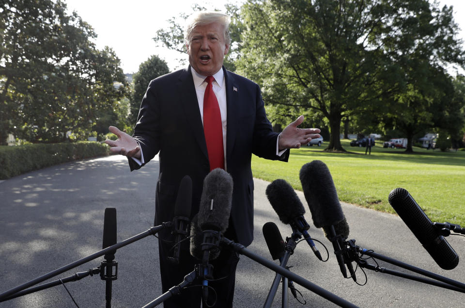 President Donald Trump talks with reporters before departing on Marine One for the Air Force Academy graduation ceremony, Thursday, May 30, 2019, in Washington. (AP Photo/Evan Vucci)