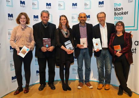 The six Man Booker shortlisted fiction authors, (L to R) Fiona Mozley, Paul Auster, Emily Fridlund, Mohsin Hamid, George Saunders and Ali Smith pose with their books, during a photo-call on the eve of the prize giving in London, Britain October 16, 2017. REUTERS/Hannah McKay