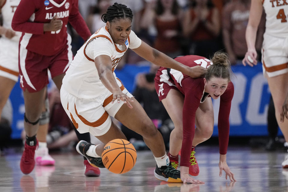 Texas forward Madison Booker, left, and Alabama guard Karly Weathers, right, chase a loose ball during the first half of a second-round college basketball game in the women’s NCAA Tournament in Austin, Texas, Sunday, March 24, 2024. (AP Photo/Eric Gay)