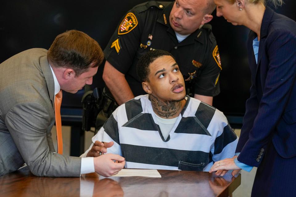 Anthony McIntosh speaks with his attorneys Brandon Fox, left, and Alex Deardoff before pleading guilty Wednesday, August 30, 2023 in the 2022 fatal shooting outside the Oakley Target store. McIntosh, 23-years-old also plead guilty in another case before Common Pleas Judge Christian Jenkins at the Hamilton County Courthouse.