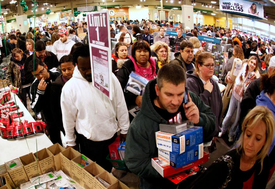Shoppers wait in the checkout line during a Black Friday sale in Kansas City, Missouri, in 2009.