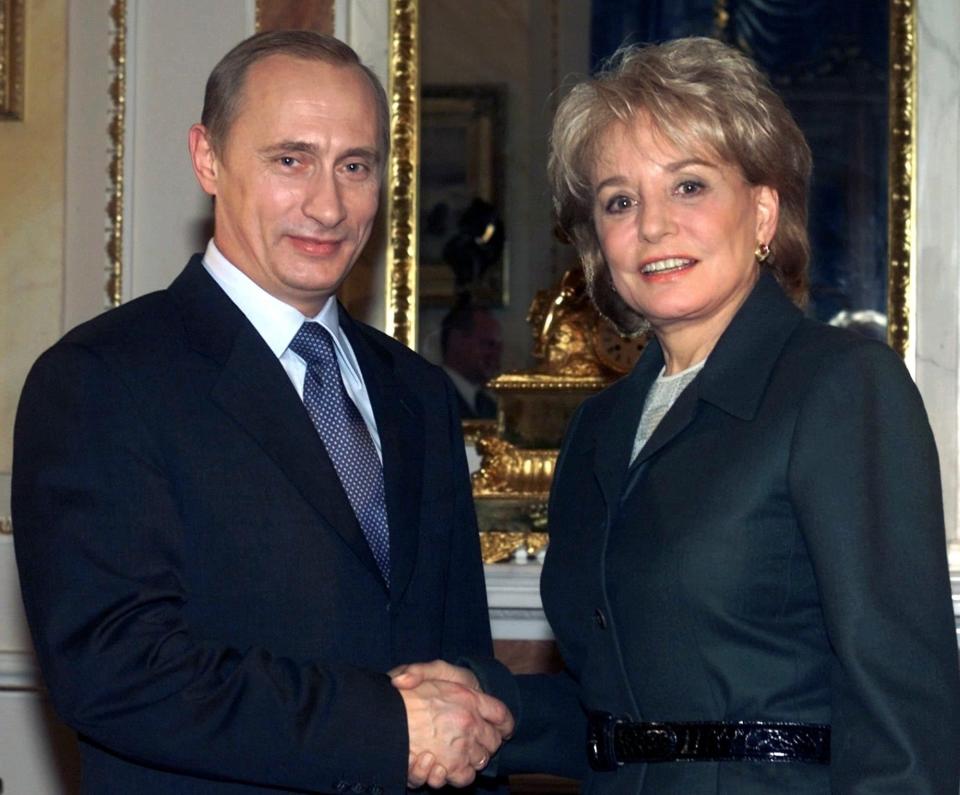 With Vladimir Putin in 2001 - AP Photo/Mikhail Metzel