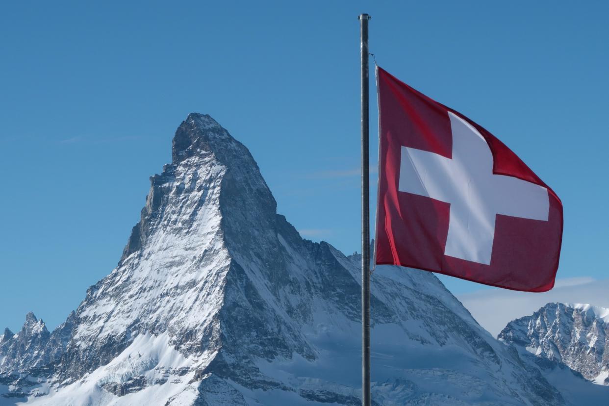 A Swiss flag flies near Matterhorn mountain on January 7, 2022 near Zermatt, Switzerland.