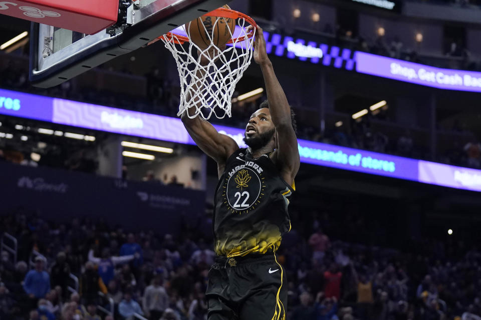 Golden State Warriors forward Andrew Wiggins dunks against the Los Angeles Clippers during the second half of an NBA basketball game in San Francisco, Wednesday, Nov. 23, 2022. (AP Photo/Jeff Chiu)