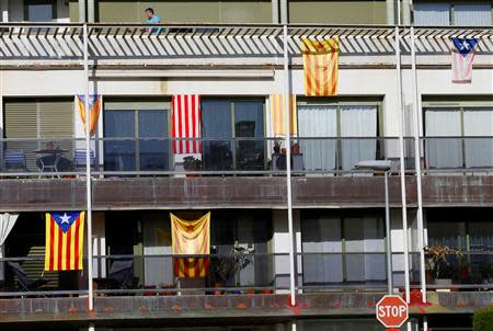 Some "Estelades" (Catalan separatist flags) are seen hung up around a building in Banyoles, Pla de L'estany near Girona, April 5, 2014. REUTERS/Gustau Nacarino