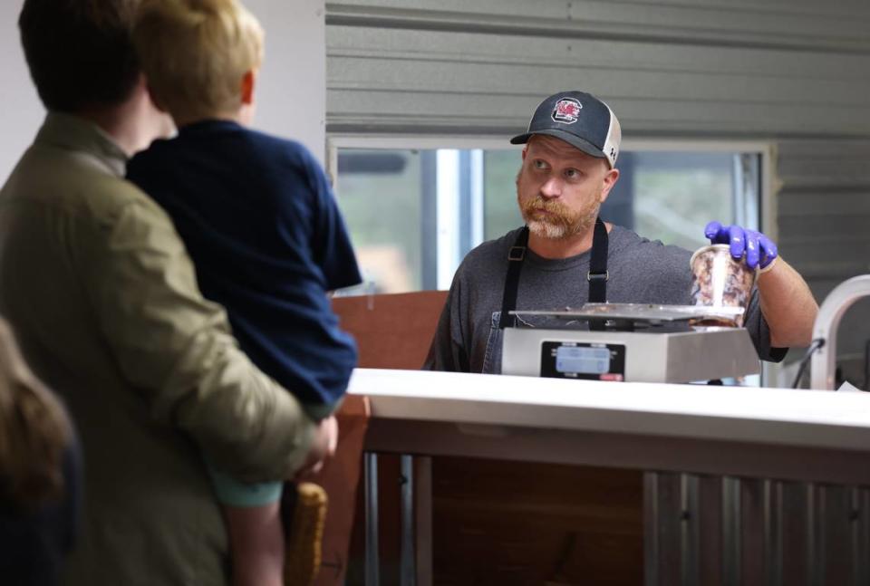 Robbie Robinson, owner of City Limits Barbeque, takes orders at his West Columbia restaurant on Saturday, March 23, 2024. Robinson is a semifinalist for Best Chef in the southeast in the 2024 James Beard Foundation Awards.