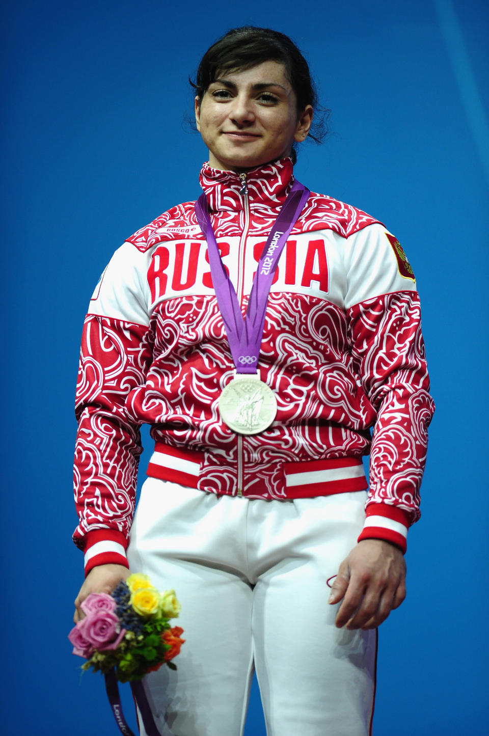 LONDON, ENGLAND - JULY 31: Svetlana Tsarukaeva of Russia stands on the podium with her silver medal after the Women's 63kg Weightlifting final on Day 4 of the London 2012 Olympic Games at ExCeL on July 31, 2012 in London, England. (Photo by Laurence Griffiths/Getty Images)