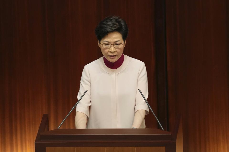 Hong Kong Chief Executive Carrie Lam delivers her policies at the chamber of Legislative Council in Hong Kong, Wednesday, Oct. 6, 2021. Lam announced a major development plan Wednesday for Hong Kong's border area with mainland China in the last annual policy address of her current term. (AP Photo/Kin Cheung)