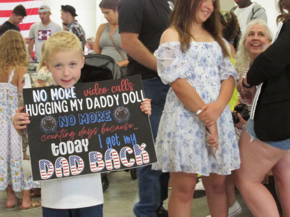 Jackson Henderson, 6, waits for his father, Staff Sgt. Daniel Henderson, on Tuesday, June 28, 2022, at Fort Bragg's Green Ramp, as Staff Sgt. Henderson and other paratroopers arrived back home from a deployment to Poland.