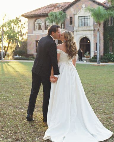 <p>Fox & Film Photography</p> Clayton Grimm and Bella Grimm share a kiss.