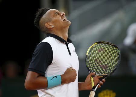 Nick Kyrgios of Australia celebrates his victory over Roger Federer of Switzerland at the end of their match at the Madrid Open tennis tournament in Madrid, Spain, May 6, 2015. REUTERS/Susana Vera