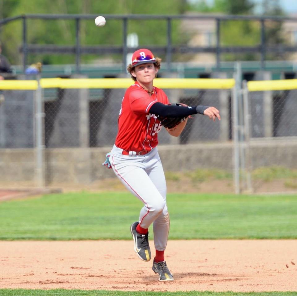 Ripon’s Dawson Downs makes a throw from third base during a Trans Valley League game against Hughson at Ripon High School in Ripon, Calif. on April 18, 2024.