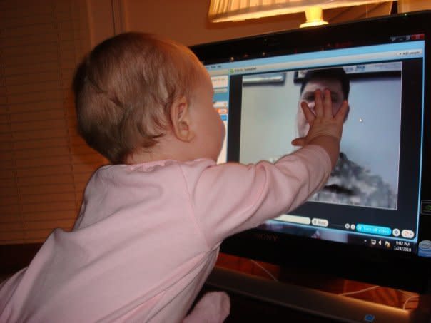 These two pictures are of our daughter Julia (9 months old) "talking" to her Daddy over Skype while he was deployed to Afghanistan.   