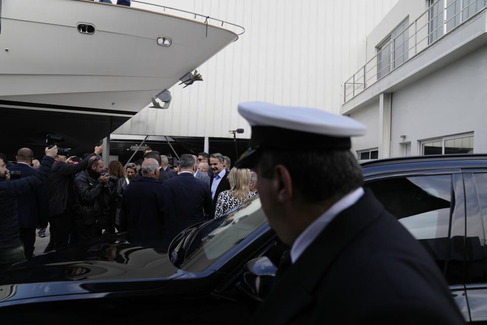 Greece's Prime Minister and New Democracy leader Kyriakos Mitsotakis arrives at a shipyard, during his election campaign in Perama, western Athens, Greece, Wednesday, May 3, 2023. (AP Photo/Thanassis Stavrakis)