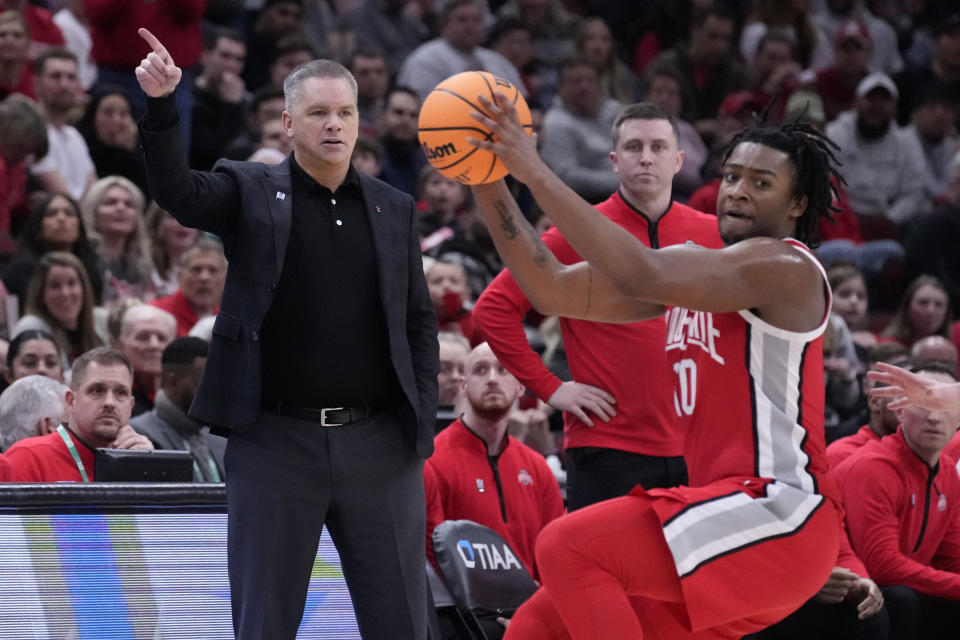 Ohio State head coach Chris Holtman directs his team during the second half of an NCAA college basketball game against Wisconsin at the Big Ten men's tournament, Wednesday, March 8, 2023, in Chicago. (AP Photo/Charles Rex Arbogast)