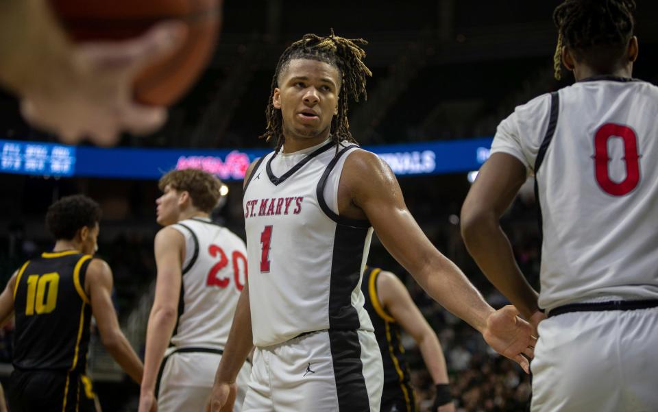 Orchard Lake St. Marys Trey McKenney looks at his teammate Trenten Bolhouse during the MHSAA Div. 1 state finals against North Farmington at the Breslin Center in East Lansing on Saturday, March 16, 2024.