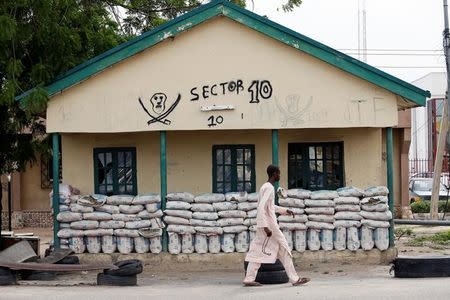 A man walks past a local vigilantes' office in Maidugugri, Borno, Nigeria August 31, 2016. REUTERS/Afolabi Sotunde