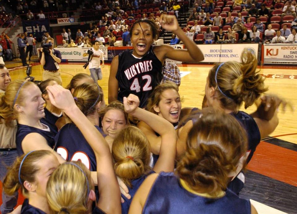 Crystal Kelly (42) and her Sacred Heart teammates celebrate after their defeat of Lexington Catholic in the state championship game at E.A. Diddle Arena in Bowling Green in 2004.