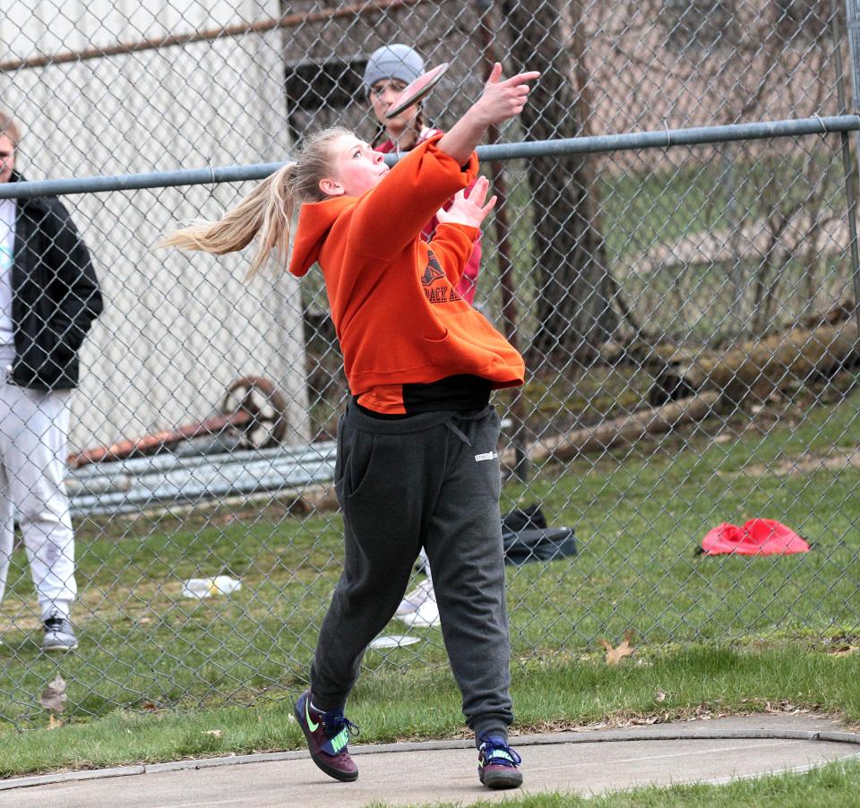 Jillian Romanyk throws the discus for Sturgis in a track and field event during April 2022.