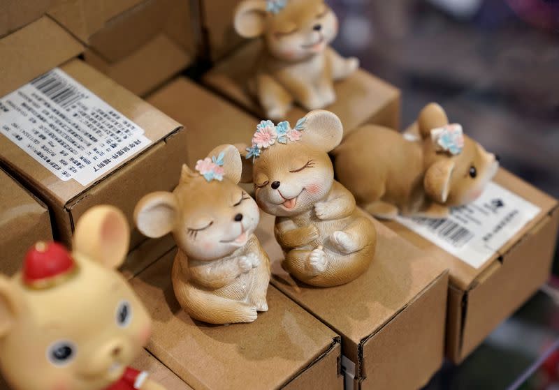 Lunar New Year of the Rat decorations are displayed for sale at a shopping mall in Beijing