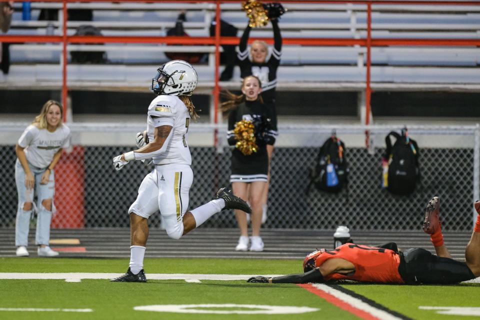 McAlester's Blaze Baugh (7) runs for a touchdown of a kick off during a high school football game between the Del City Eagles and the McAlester Buffalos at Robert Kalsu Stadium at Del City High School in Del City on Friday, Sept. 30, 2022.