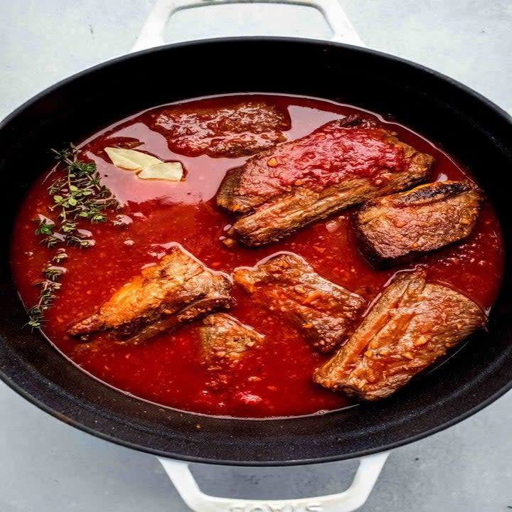 Braised short ribs in tomato sauce.