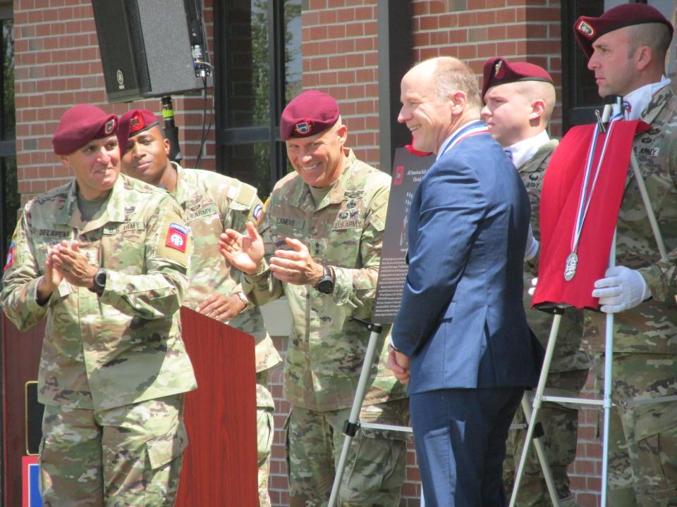 Retired Gen. Stephen Lyons, far right, is congratulated by  Maj. Gen. Christopher LaNeve, second from right, and Command Sgt. Maj. Randolph Delapena, after being inducted into the 82nd Airborne Division Hall of Fame during a ceremony Wednesday, May 24, 2023, at Fort Bragg.