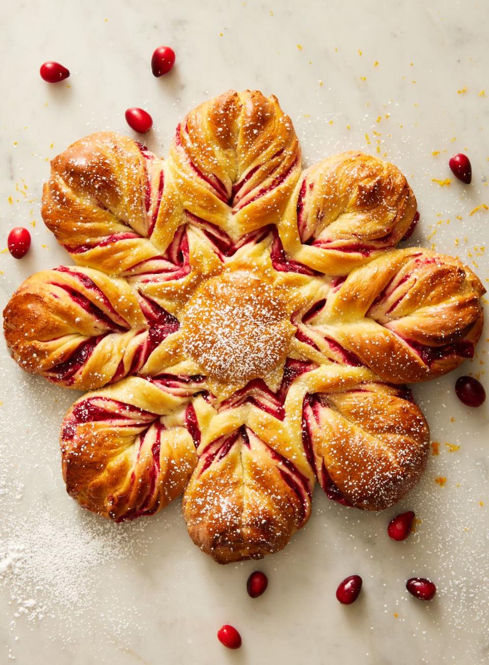 <p>Looking for a <a href="https://www.delish.com/holiday-recipes/g4453/holiday-baking-recipes/" rel="nofollow noopener" target="_blank" data-ylk="slk:holiday baking;elm:context_link;itc:0;sec:content-canvas" class="link ">holiday baking</a> project that will look stunning and taste even better? Meet this cranberry-orange star bread. Filled with homemade <a href="https://www.delish.com/holiday-recipes/thanksgiving/g309/fresh-cranberries/" rel="nofollow noopener" target="_blank" data-ylk="slk:cranberry;elm:context_link;itc:0;sec:content-canvas" class="link ">cranberry</a> sauce and effortlessly twisted into a visually intricate shape, this soft, fragrant, sweet <a href="https://www.delish.com/cooking/recipe-ideas/g32055235/best-bread-recipes/" rel="nofollow noopener" target="_blank" data-ylk="slk:bread;elm:context_link;itc:0;sec:content-canvas" class="link ">bread</a> will delight friends and family everywhere.</p><p>Get the <strong><a href="https://www.delish.com/cooking/recipe-ideas/a42027787/cranberry-orange-star-bread-recipe/" rel="nofollow noopener" target="_blank" data-ylk="slk:Cranberry-Orange Star Bread recipe;elm:context_link;itc:0;sec:content-canvas" class="link ">Cranberry-Orange Star Bread recipe</a></strong>. </p>