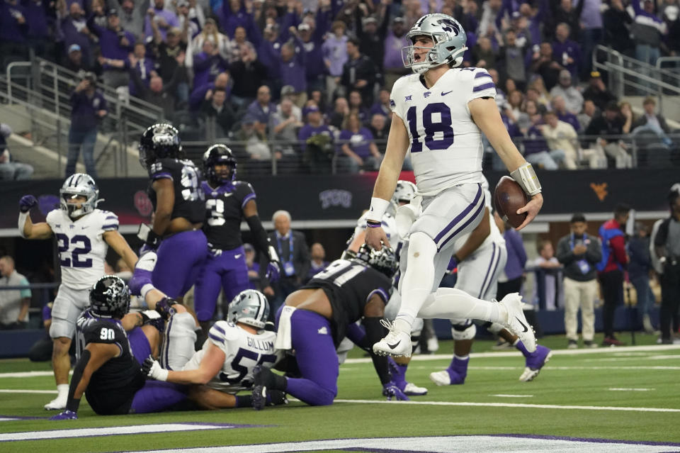 Kansas State quarterback Will Howard (18) runs into the end zone for a touchdown in the first half of the Big 12 Conference championship NCAA college football game against TCU, Saturday, Dec. 3, 2022, in Arlington, Texas. (AP Photo/LM Otero)