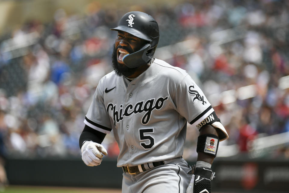 Chicago White Sox second baseman Josh Harrison shouts as he heads to the dugout after hitting a three-run home run against the Minnesota Twins during the seventh inning of a baseball game, Sunday, July 17, 2022, in Minneapolis. (AP Photo/Craig Lassig)