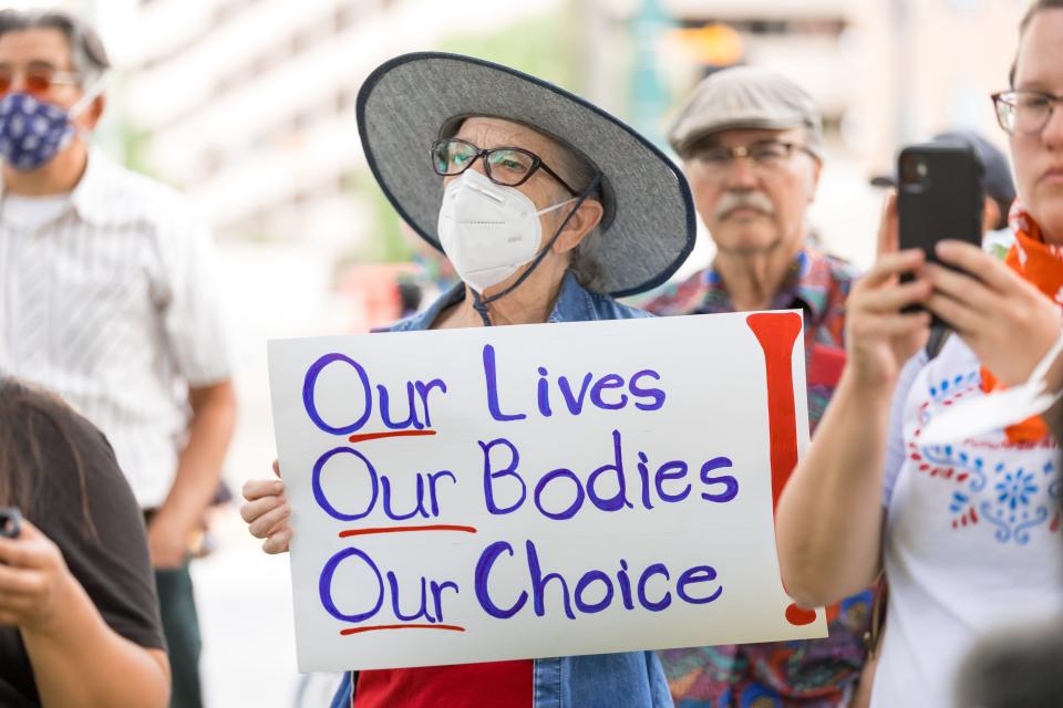 El Pasoans join Planned Parenthood on Tuesday, May 3, 2022, on the sidewalk outside the U.S. Federal Courthouse in El Paso, Texas, raising their voice to protect abortion access.