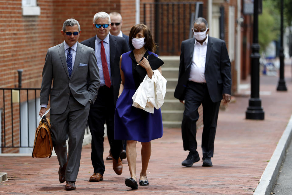 Former Baltimore Mayor Catherine Pugh, center right, walks with her attorney Steve Silverman, left, as she arrives at the Anne Arundel County Circuit Court in Annapolis, Md., before pleading guilty to a state perjury charge Friday, June 19, 2020, for failing to disclose a business interest relating to her “Healthy Holly” children’s books on her financial disclosure forms when she was a state senator. Pugh, a 70-year-old Democrat, already has been sentenced to three years in federal prison for netting hundreds of thousands of dollars in the self-dealing scandal over the books that touted exercise and nutrition. (AP Photo/Julio Cortez)