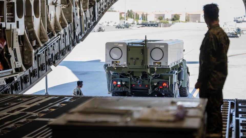 Program Manager Long Range Fires (PM LRF) New Equipment Training Team (NETT) U.S. Marine instructor, backs a Navy/Marine Corps Expeditionary Ship Interdiction System (NMESIS) Launcher onto a C-17 Globemaster III at Travis Air Force Base, California, Sept. 25, 2023. (Senior Airman Lauren Jacoby/US Air Force)