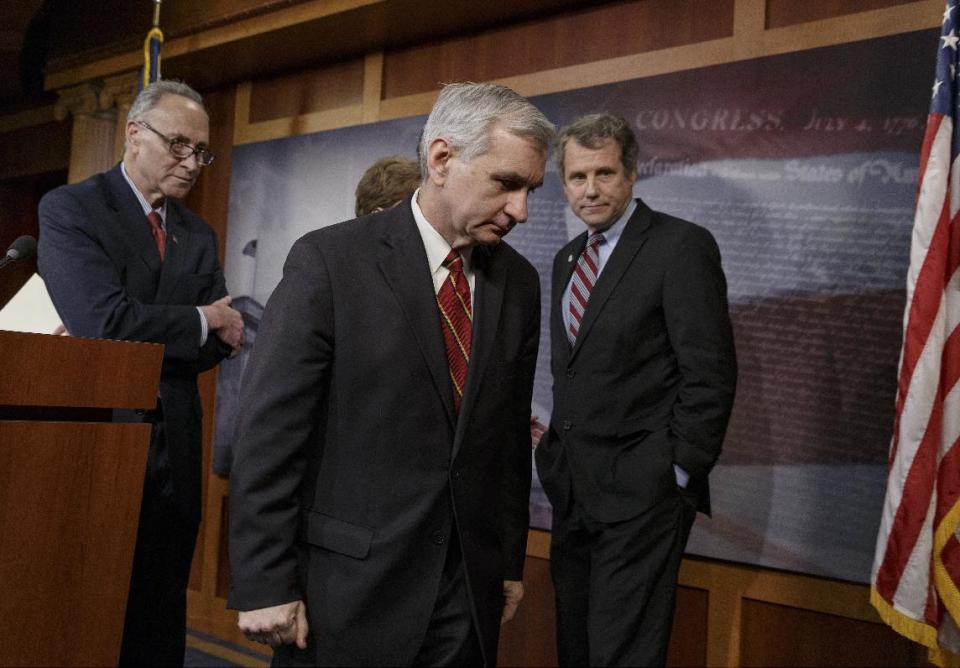 Sen. Jack Reed, D-R.I., center, joined by Sen. Charles Schumer, D-N.Y., left, and Sen. Sherrod Brown, D-Ohio, right, leaves a news conference on Capitol Hill in Washington, Tuesday, Jan. 7, 2014, after legislation to renew jobless benefits for the long-term unemployed unexpectedly cleared an initial Senate hurdle. The vote was 60-37 to limit debate on the legislation, with a half-dozen Republicans siding with the Democrats on the test vote. Sen. Reed, along with Republican Sen. Dean Heller of Nevada, led the effort to reauthorize the benefits for three months which expired on Dec. 28. (AP Photo/J. Scott Applewhite)