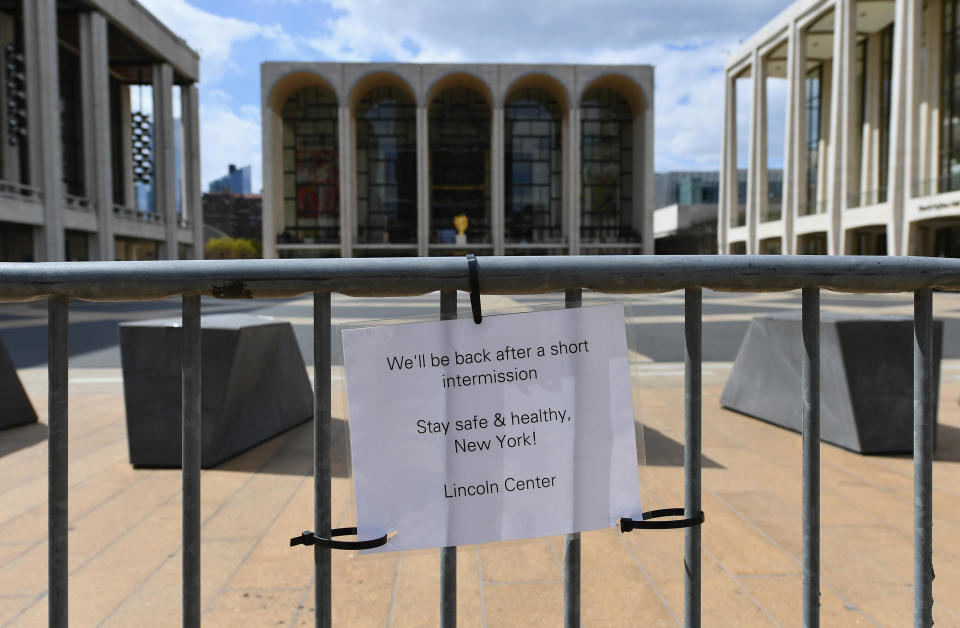 A sign is displayed outside Lincoln Center on April 16, 2020 in New York City.  / Credit: ANGELA WEISS/AFP via Getty Images