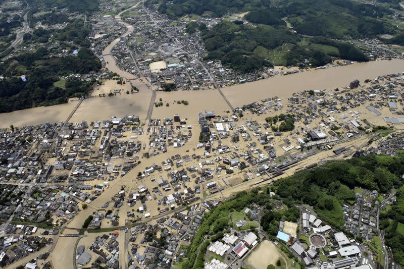 An aerial view shows flooded Kuma River caused by heavy rain at a residential area in Hitoyoshi, Japan