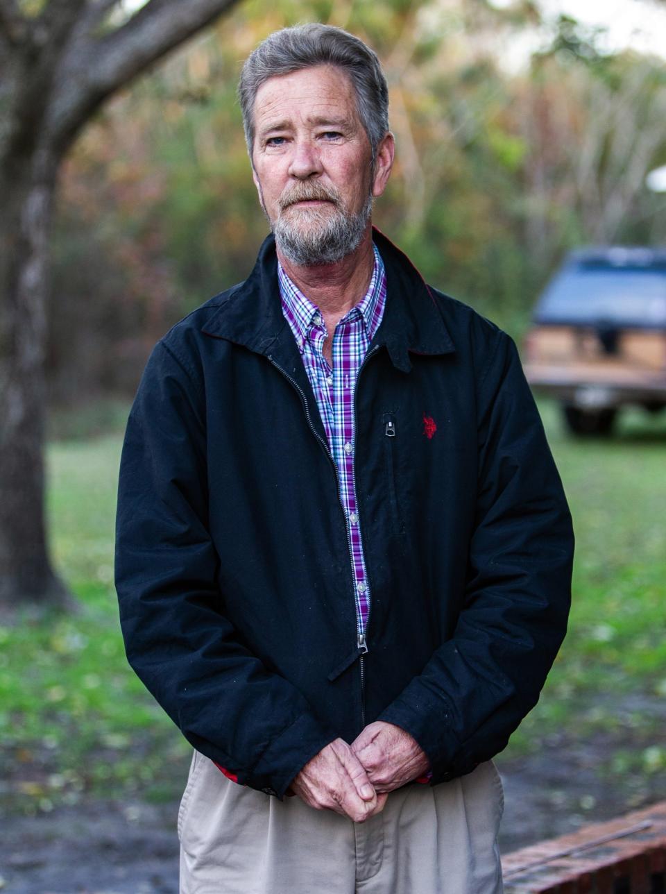 FILE - In this Dec. 5, 2018, file photo, Leslie McCrae Dowless Jr., poses for a portrait outside his home in Bladenboro, N.C. State investigators have described Dowless as a “person of interest” in their probe into 2018 voting irregularities involving absentee ballots. (Travis Long/The News & Observer via AP, File)