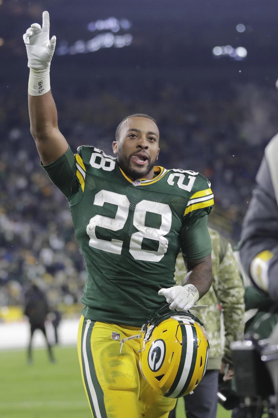 Green Bay Packers' AJ Dillon reacts as he walks off the field after an NFL football game against the Seattle Seahawks Sunday, Nov. 14, 2021, in Green Bay, Wis. The Packers won 17-0. (AP Photo/Aaron Gash)