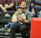 <p>The devoted dad carved out time to take his favorite boy, his son Jack, to see the Los Angeles Clippers play the Minnesota Timberwolves at Staples Center in L.A. on Wednesday. The <em>Jurassic World: Fallen Kingdom </em>star gave Jack courtside cuddles, as the cutie pie munched on some popcorn. (Photo: Allen Berezovsky/Getty Images) </p>