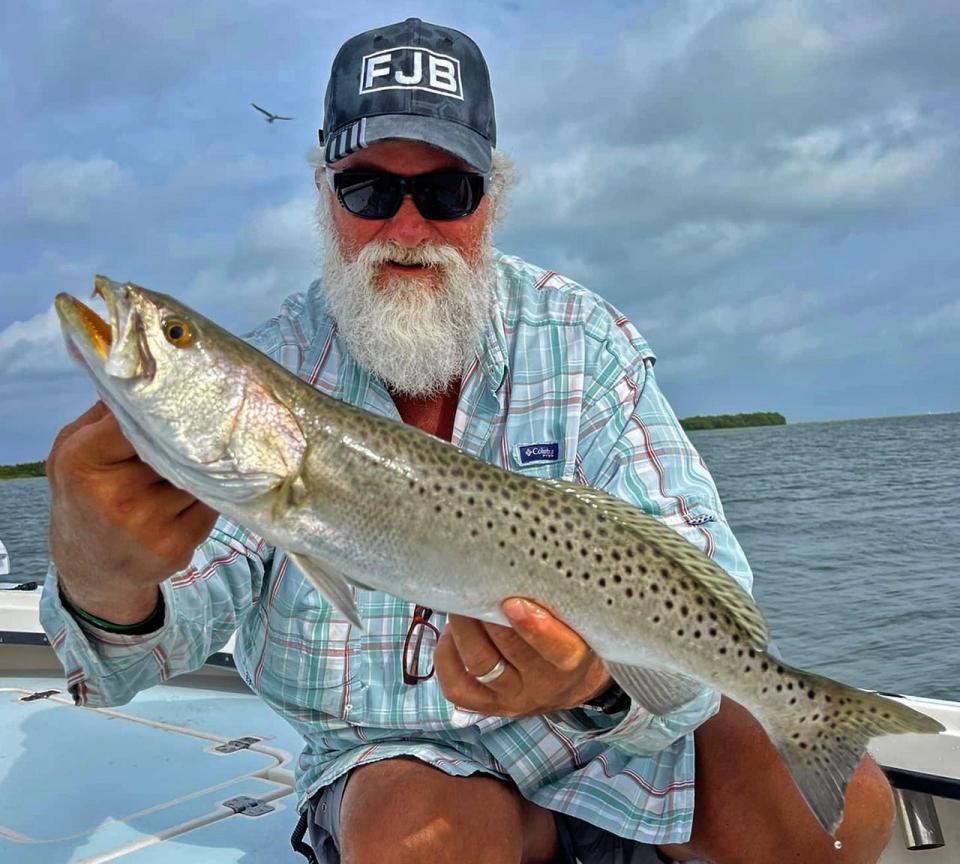 Rufus Wakeman of Jensen Beach shows off a 24-inch speckled trout he caught on a live scaled sardine while fishing in Tarpon Springs with Capt. Brian Dopirak of Clear Flats Fishing this week. 