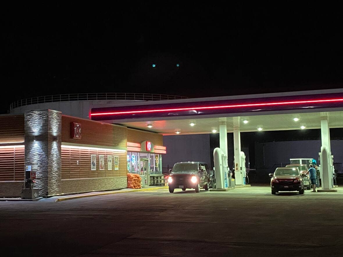 Late Thursday, drivers at this Charlottetown station were filling up their vehicles as well as smaller containers for generators and chainsaws.  (Carolyn Ryan/CBC - image credit)