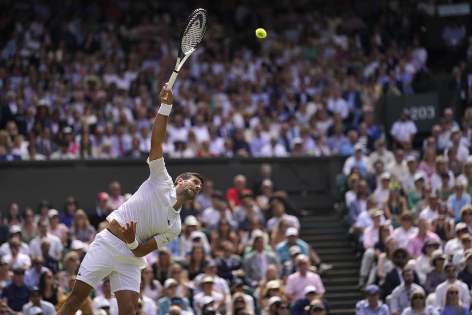Serbia's Novak Djokovic returns to Poland's Hubert Hurkacz in a men's singles match on day eight of the Wimbledon tennis championships in London, Monday, July 10, 2023. (AP Photo/Alberto Pezzali)