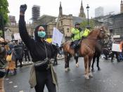 Mounted police watch demonstrators during a Black Lives Matter protest in Parliament Square, following the death of George Floyd who died in police custody in Minneapolis, in London