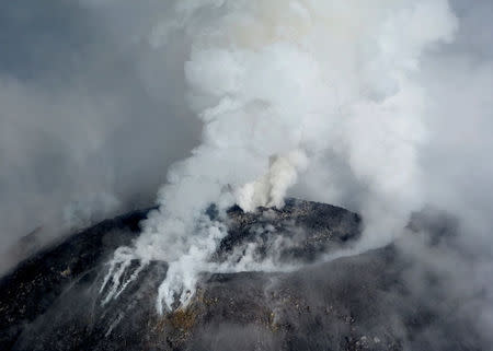 An aerial view shows the crater of the Mexican Colima or "Fire" Volcano spewing gas and ash in this handout photo released to Reuters by Civil Protection of Jalisco on September 30, 2016. Civil Protection of Jalisco/Handout via REUTERS