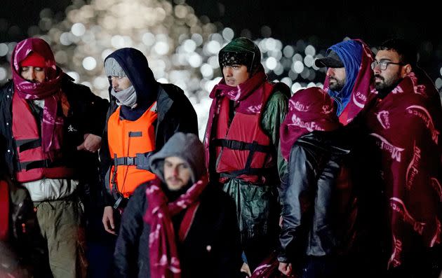 A group of people thought to be migrants are brought in to Dover, Kent, following a small boat incident in the Channel after 27 people drowned on Wednesday (Photo: Gareth Fuller - PA Images via Getty Images)